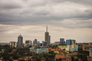 A modern infographic titled "Best Passive Income in Kenya 2026: Real Estate Investment Guide" with real estate symbols and gr